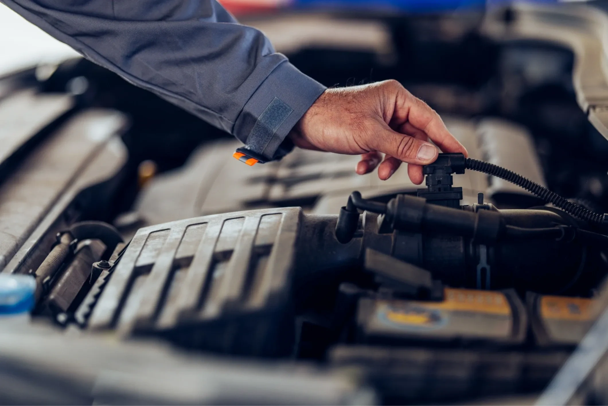 Mechanic servicing a car engine
